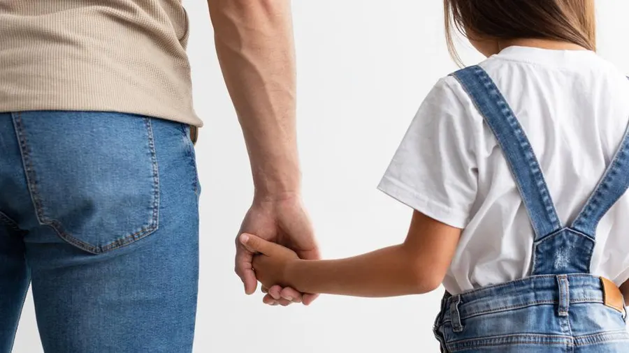 holding child's hand